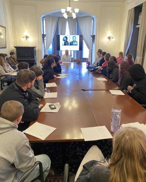 		people sitting around a table
	
