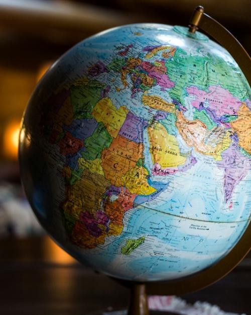 desktop globe model in a dimly lit room