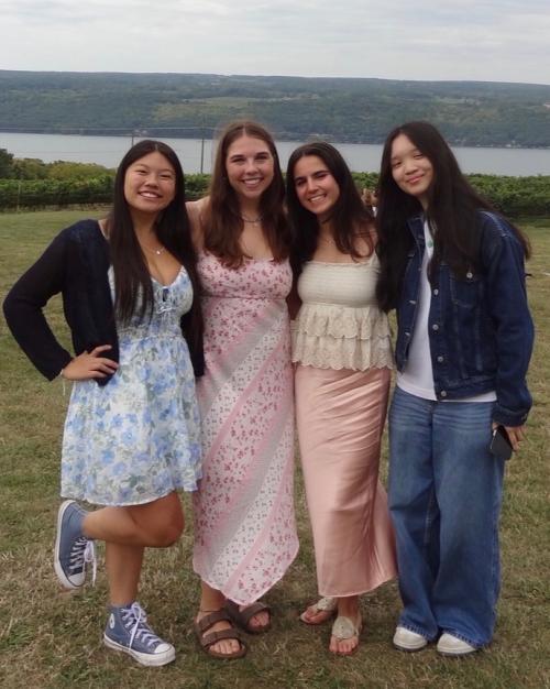group of students with lake in background