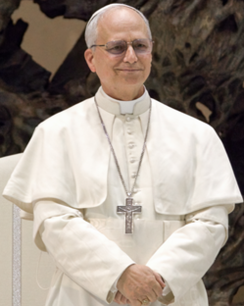 Pope Leo, in all white-clothes and wearing a big cross
