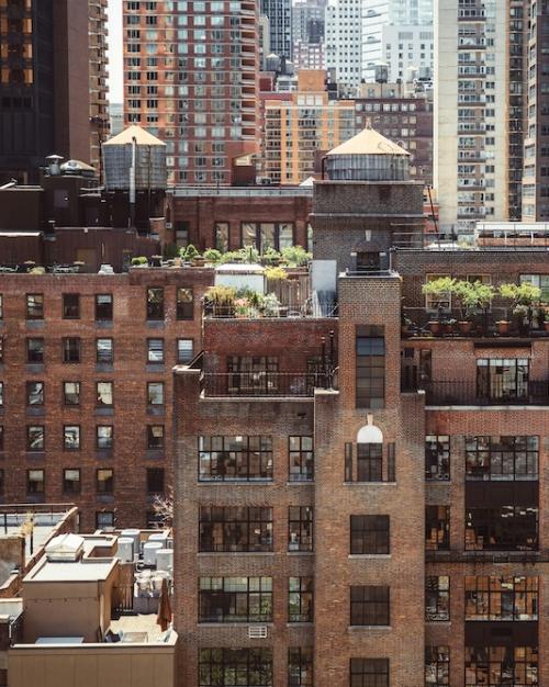layers of brick and glass buildings in a city