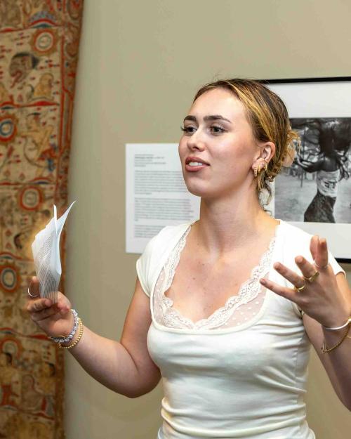 person presenting work in a museum
