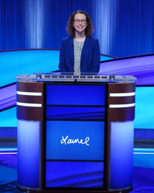 person on game show stage