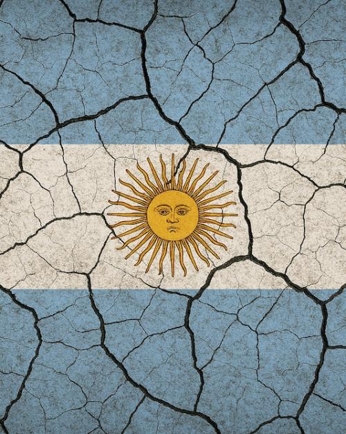 Image of the flag of Argentina (light blue bands on top and bottom with a white band in the middle and a stylized sun with a face) overlaid by cracks