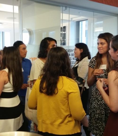  Students at an alumni networking event