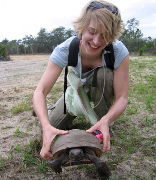  Graduate student with tortoise during field course