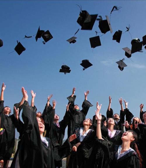  Graduates throwing caps in the air