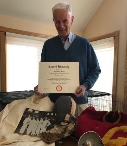  Murray poses with some of his Cornell memorabilia