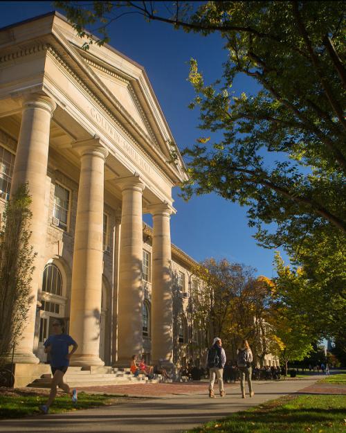 		 Students walk past Goldwin Smith Hall in the fall
	