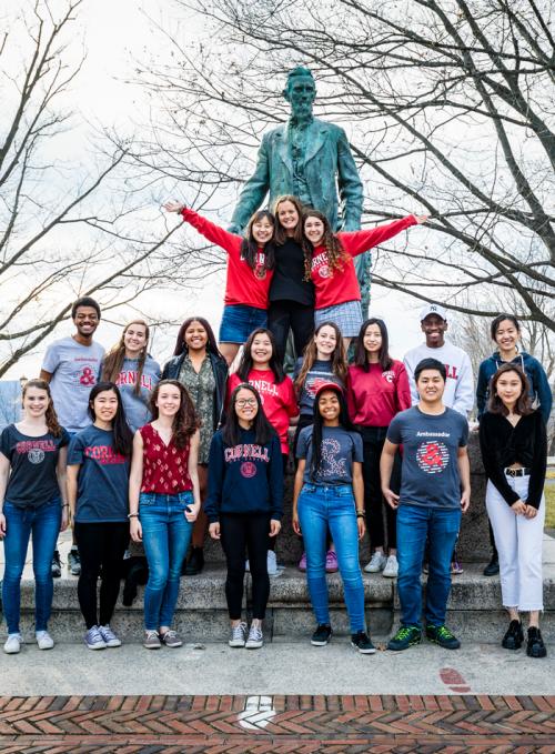  Student ambassadors standing in front of a statue of Andrew Dickson White