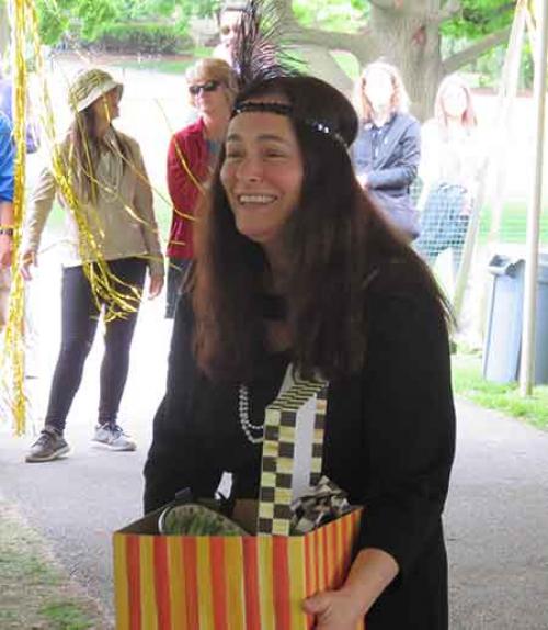  Woman carrying box with prize she won
