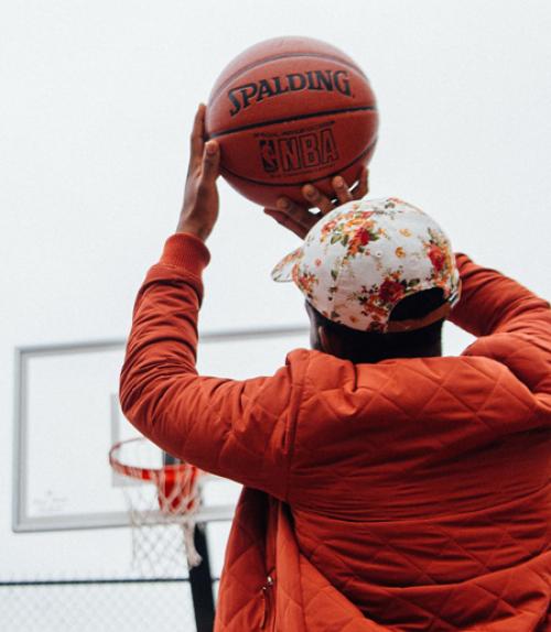  Man shooting basketball