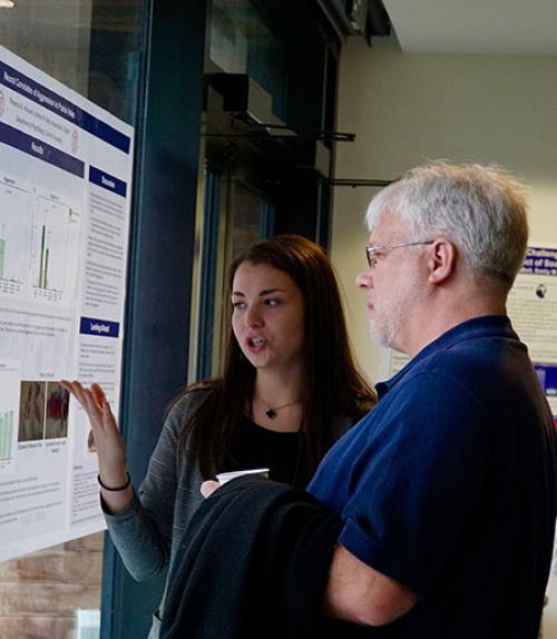  Professor David Smith asks Rebecca Horotwitz about her independent research project (&quot;Neural correlates of aggression in prairie voles&quot;) in Professor Alex Ophir&#039;s lab.   