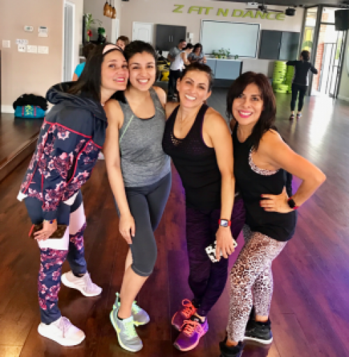  Smiling after an intense (and sweaty!) class with my Zumba mentors at my hometown studio.