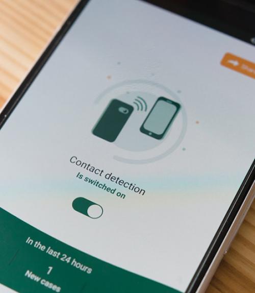 Phone showing contact tracing app