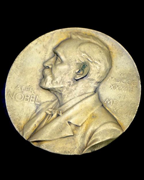 		The Nobel Prize as a Gold medal on black background
	