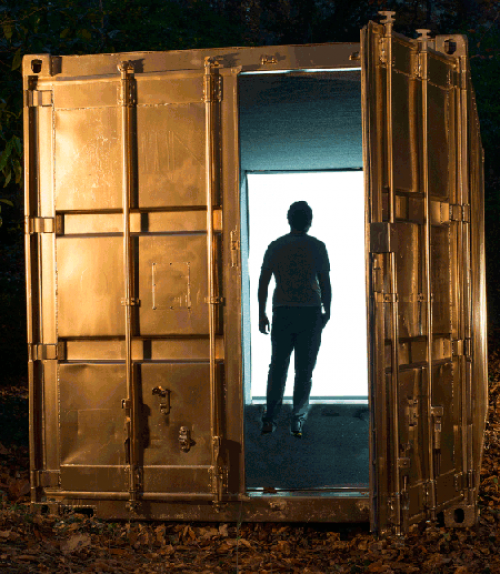  Student standing in doorway of cargo container