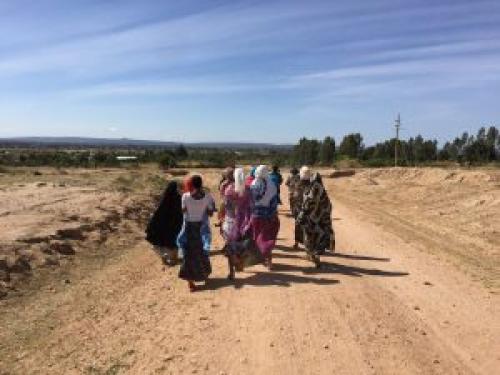  Women in Singida, Tanzania walk to the village SNAP meeting.