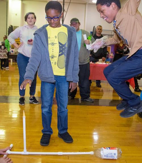  Students launch an air-powered rocket at Space Night.