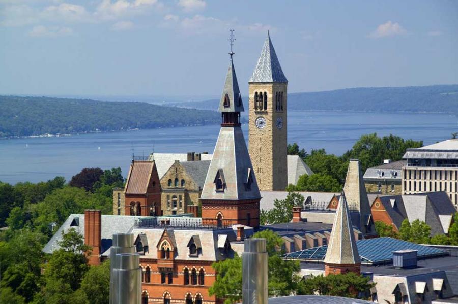 campus buildings with lake in background