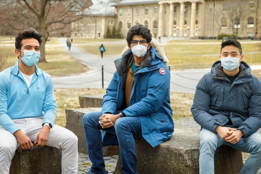 Three students on the Arts Quad
