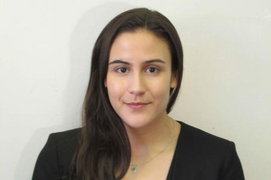 woman standing by a wall