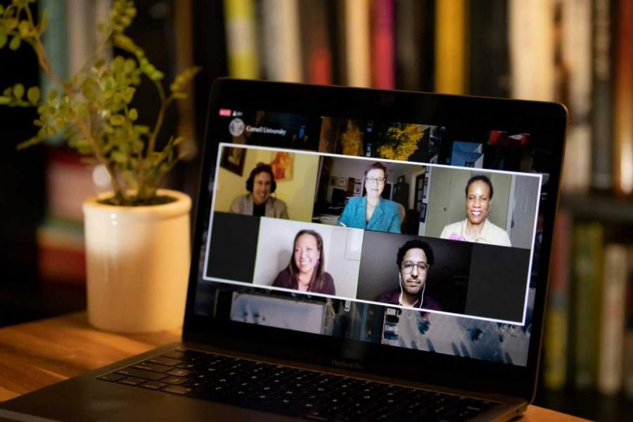 five people appear on a computer screen