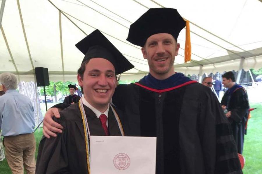 two people in graduation gowns