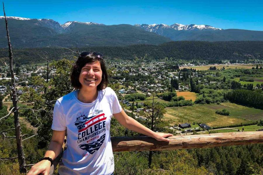 girl on trail overlooking city