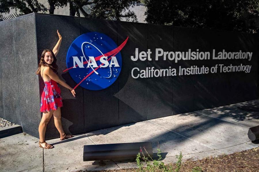 girl outside NASA sign