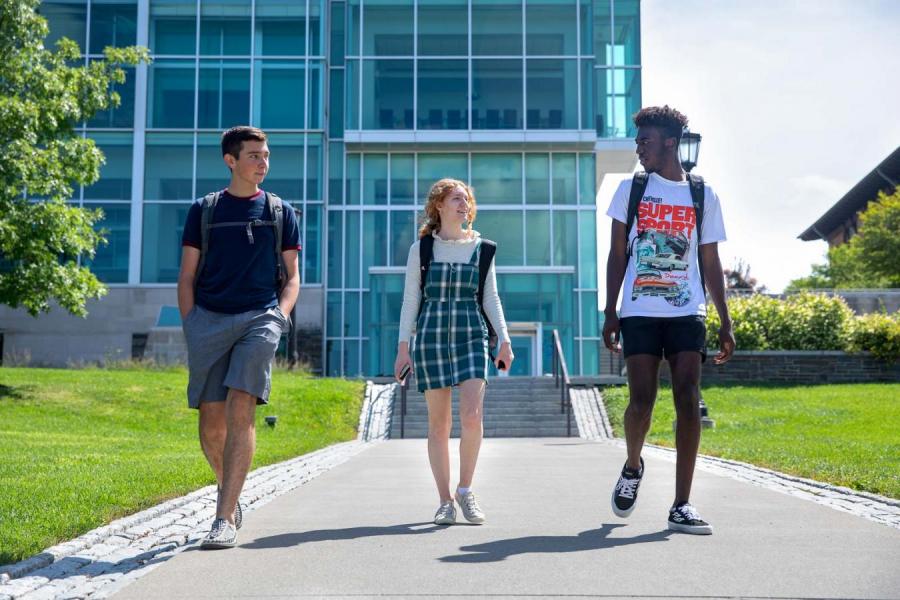 Three students in the Pre-Freshman Summer Program near the Physical Science Building.