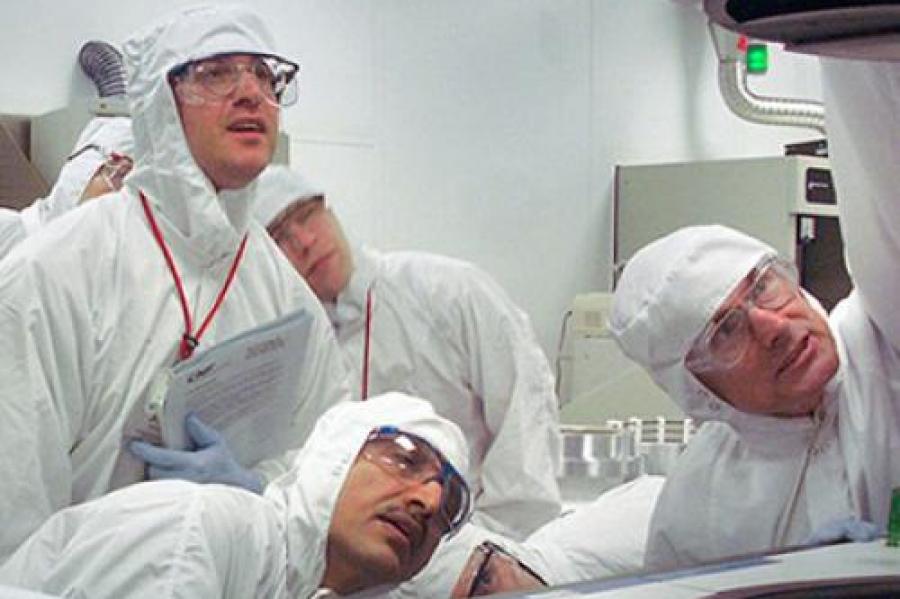 Researchers examining new equipment.