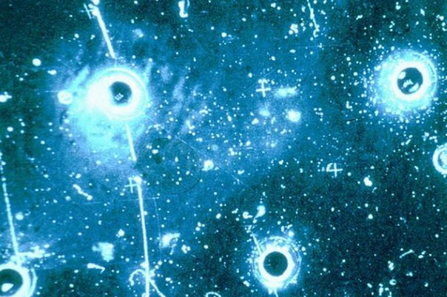 Blue circles and lines showing neutrino trail in bubble chamber