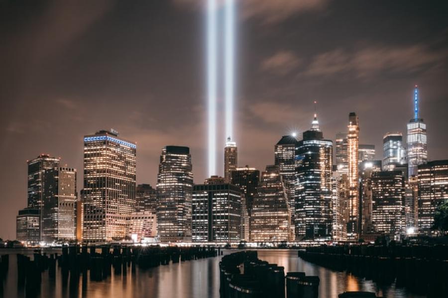 Beams of light memorializing the Twin Towers with the Manhattan skyline below.