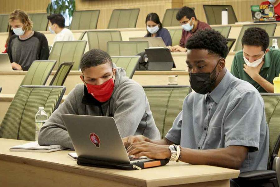 students working together on a computer