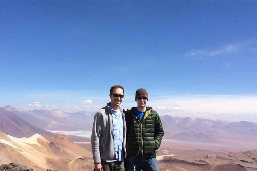 two people on top of a mountain