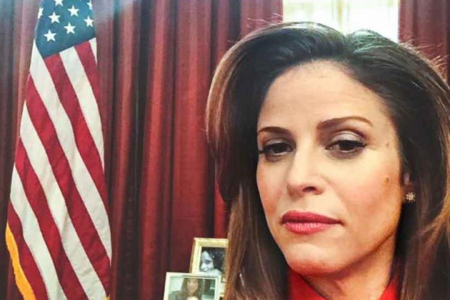 woman sitting behind desk