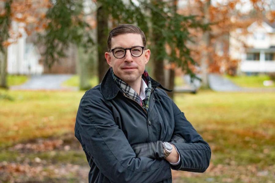 man standing by tree