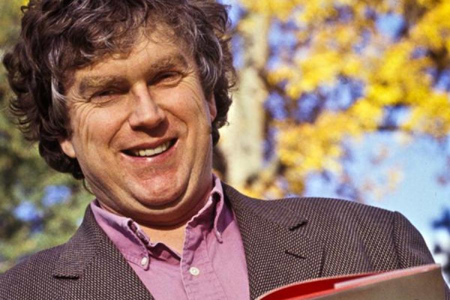 Trevor Pinch smiling and holding his book "The Golem at Large"