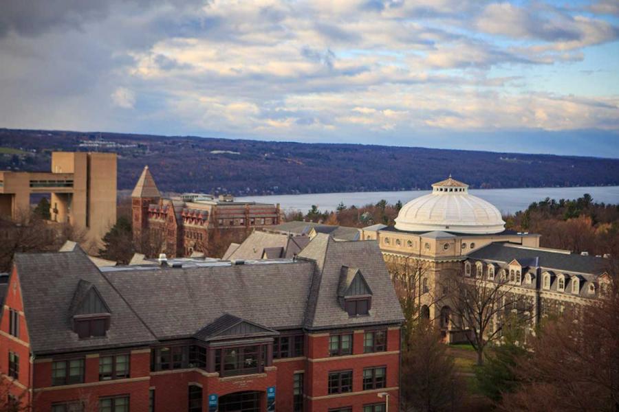 Campus buildings, cloudy sky, lake