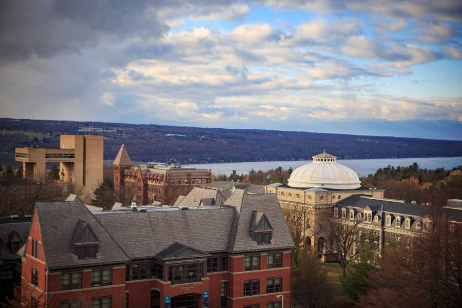 Campus buildings, cloudy sky, lake