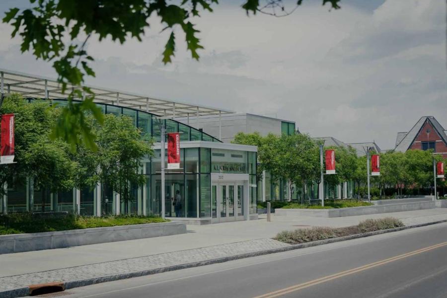 Glass building; tree-lined street