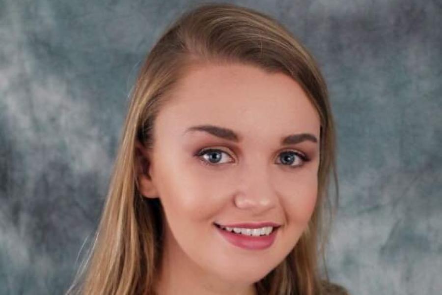 woman in brown blazer