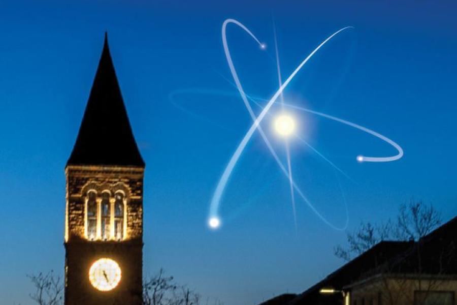 An artist's rendition of an atom in the sky next to McGraw Tower on Cornell's campus.