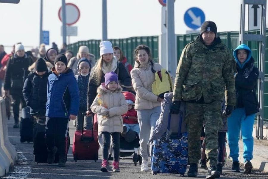 People walking through barriers