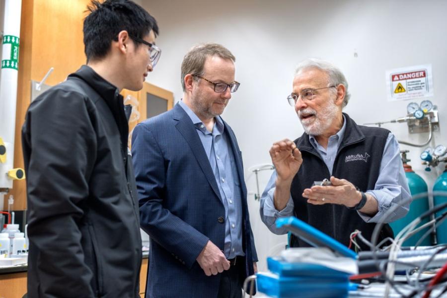 Scientists talk in a lab