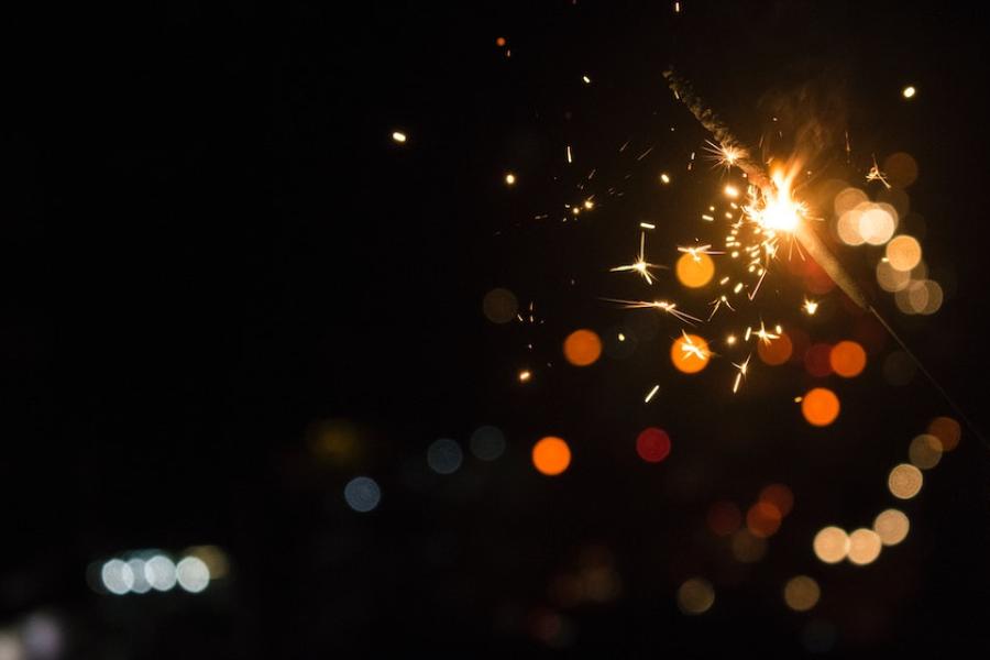 Spots of orange light against a dark background