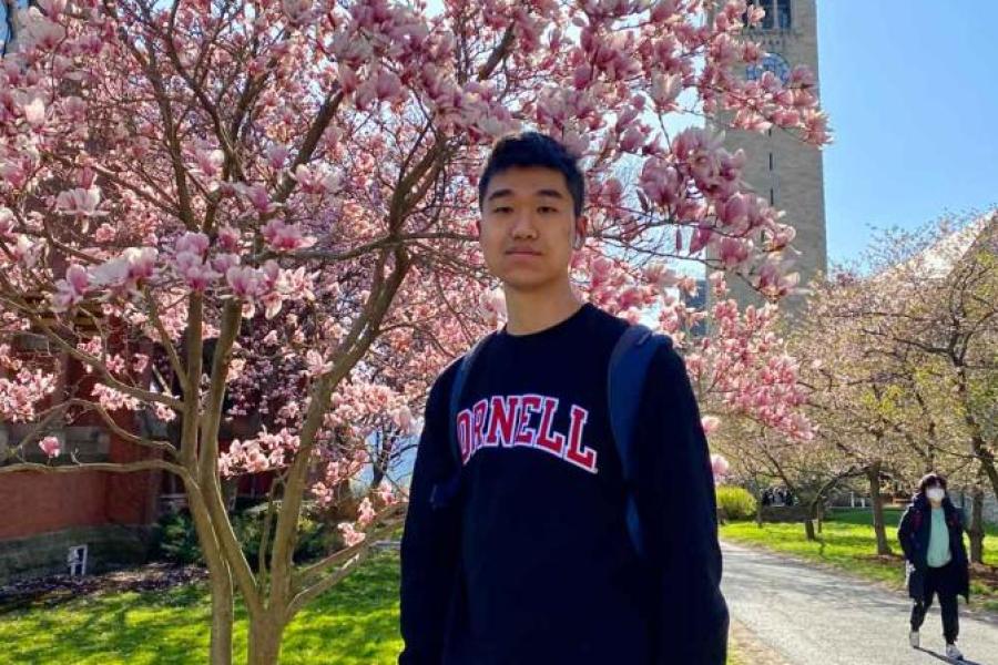 Student outside under tree