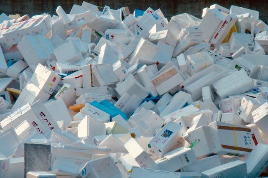 A huge pile of white styrofoam shipping boxes jumbled together.