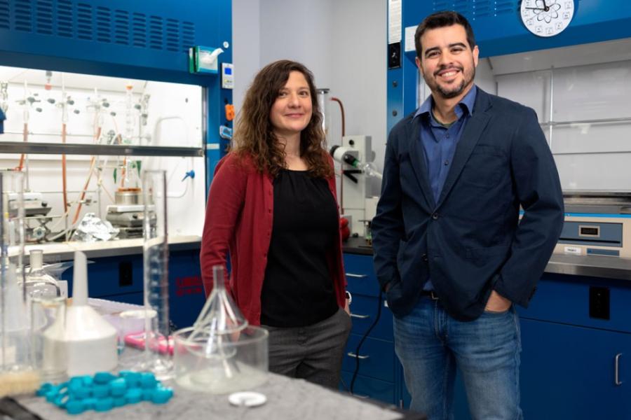 Two people stand in a lab